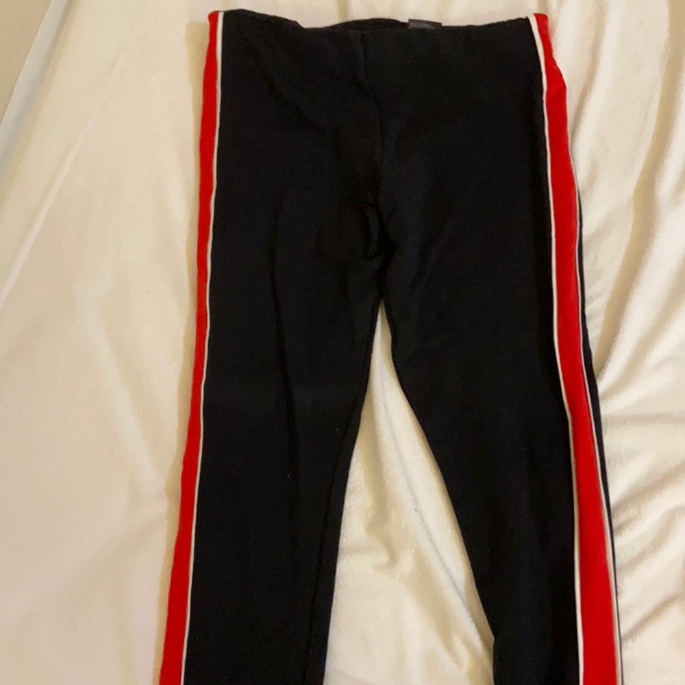 Black yoga pants with racing red lines on the side